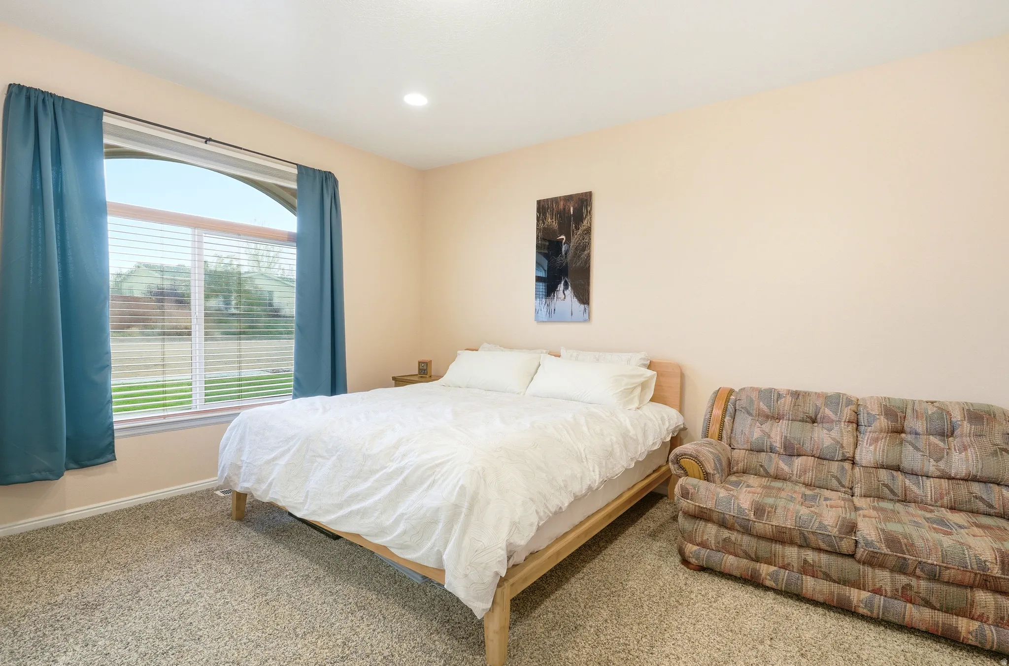 Carpeted bedroom featuring baseboards and recessed lighting