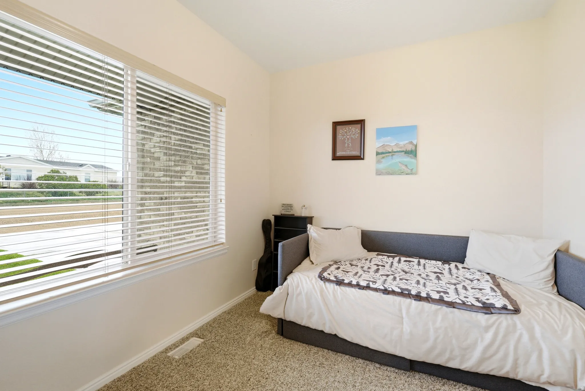 Carpeted bedroom with baseboards
