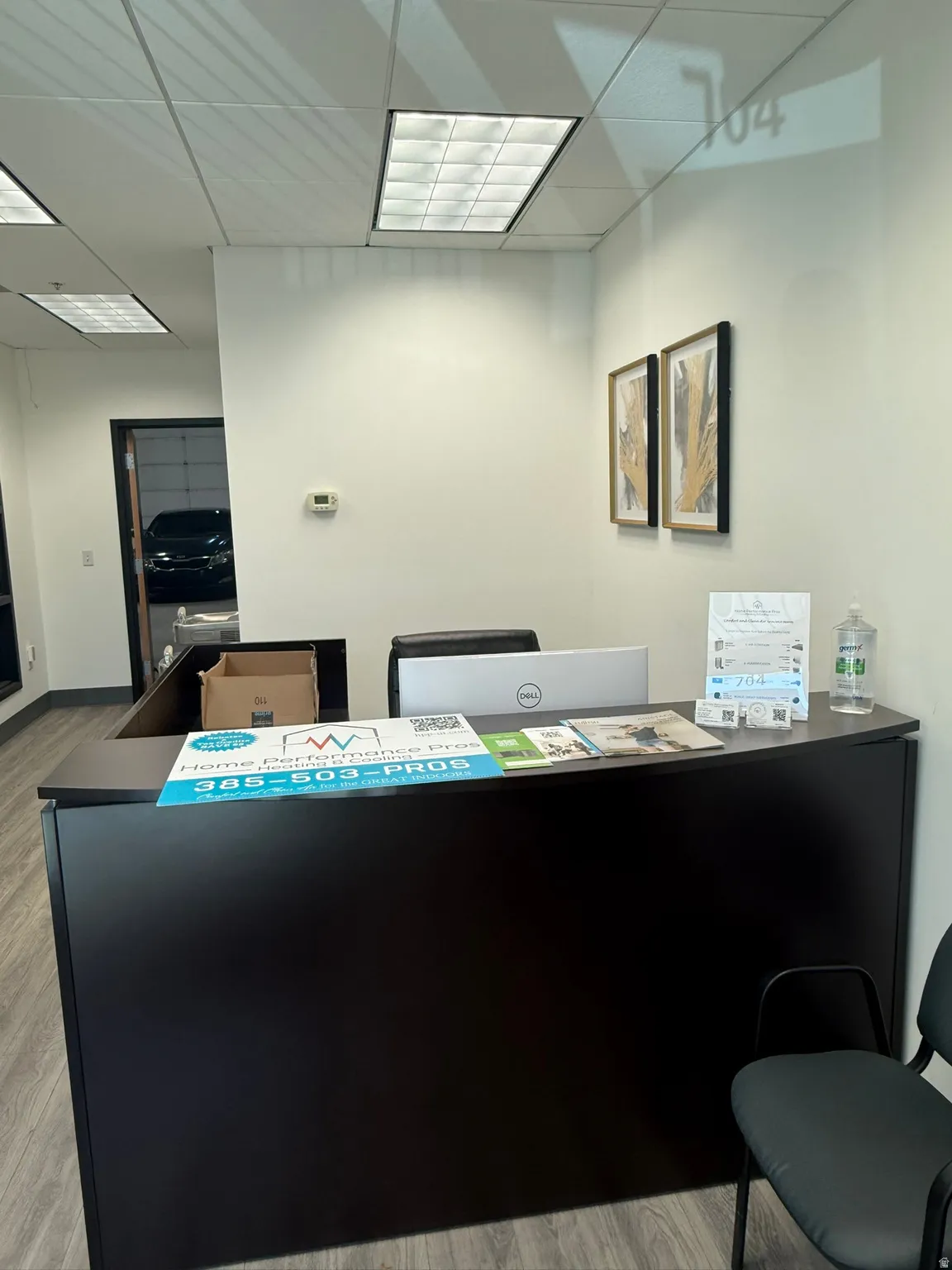 Office with a paneled ceiling