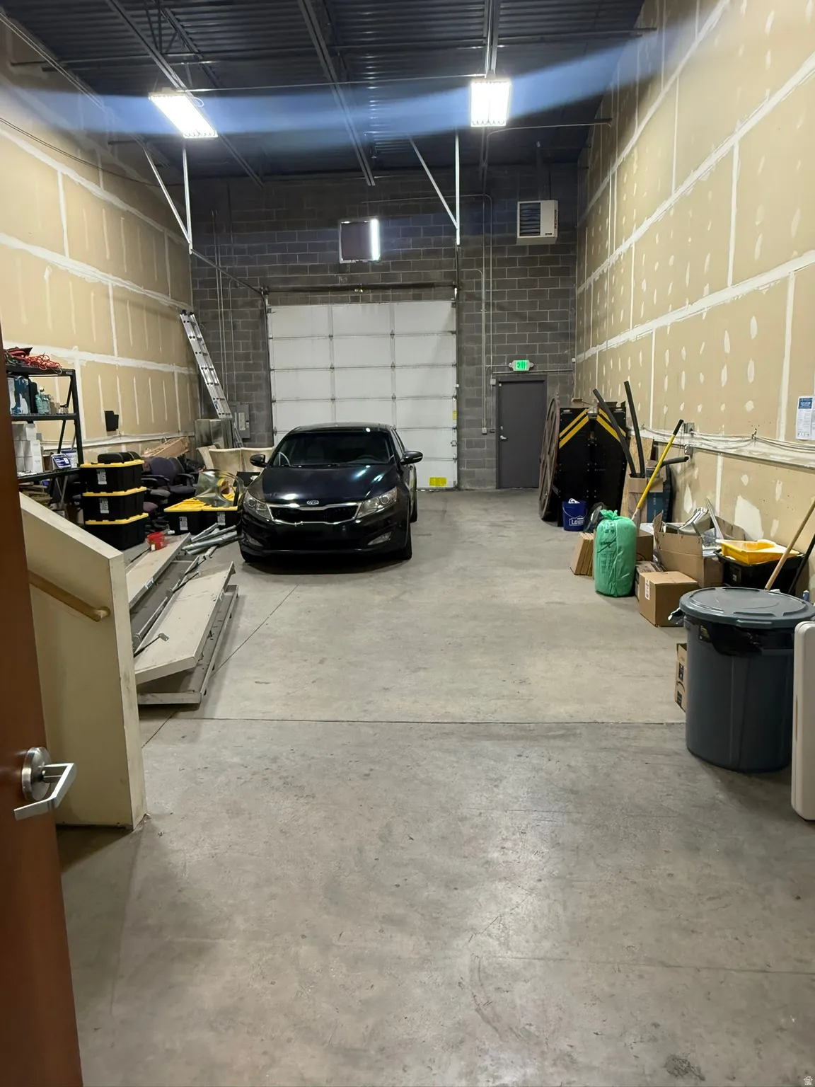 Garage featuring a heating unit