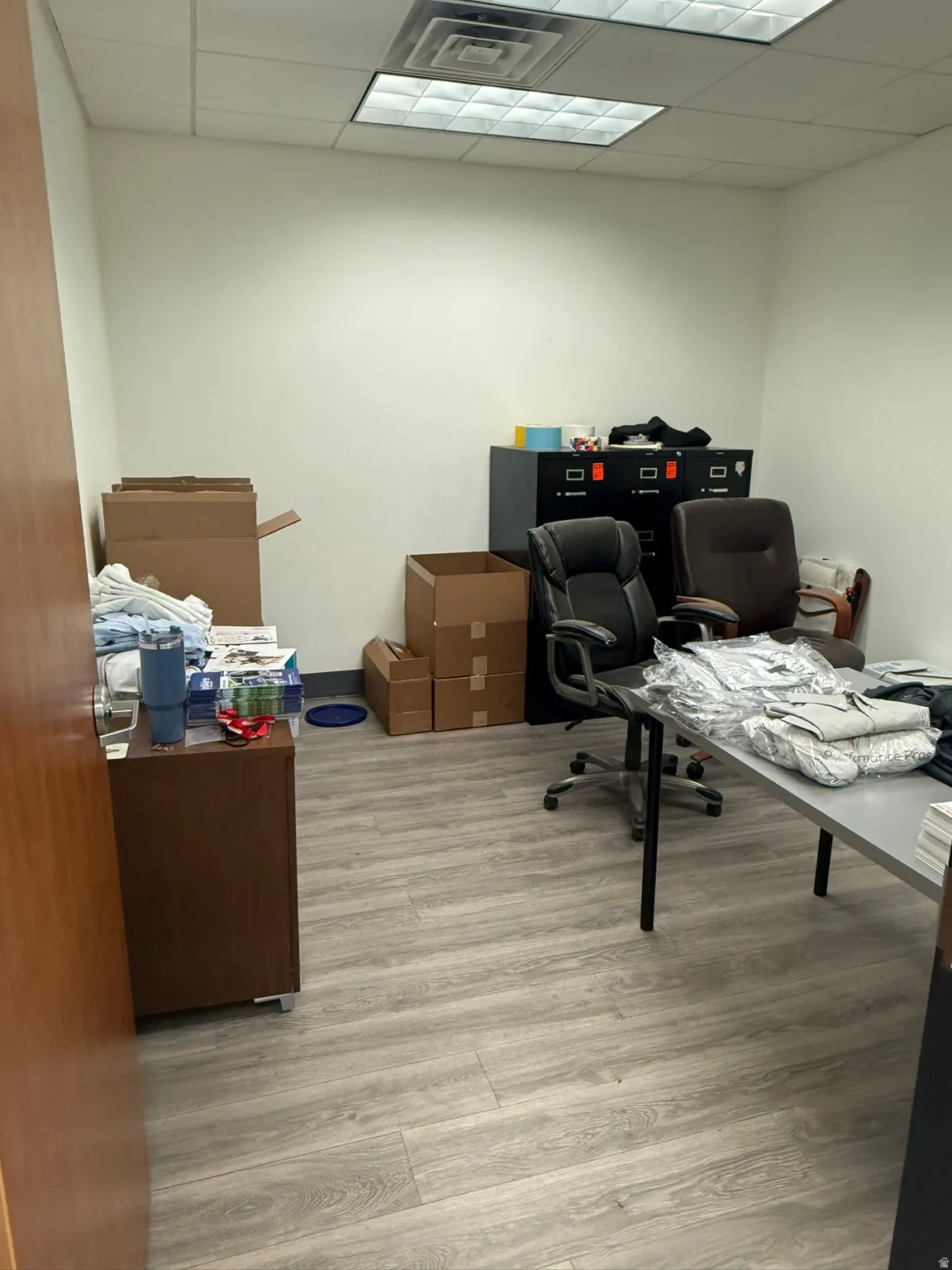 Office area with a paneled ceiling