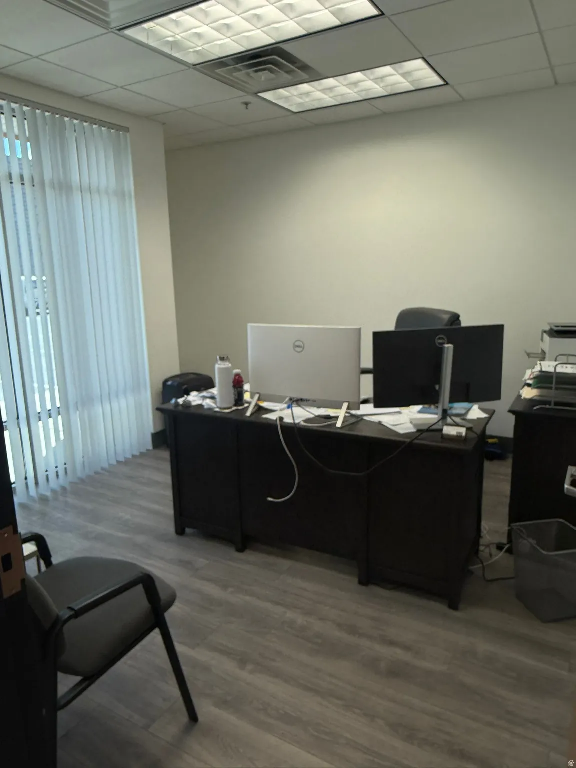 Office area with a paneled ceiling
