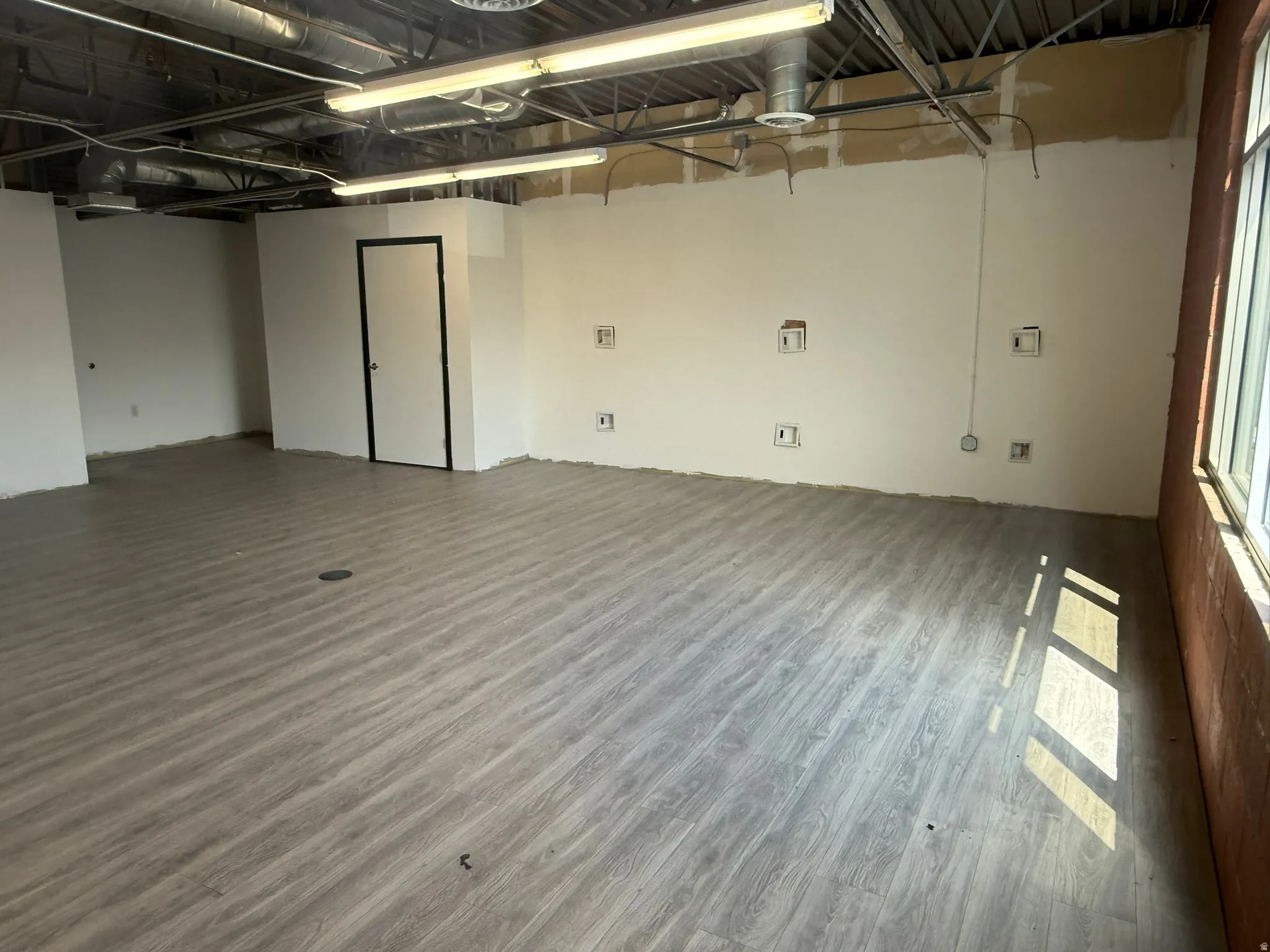 Empty room featuring wood finished floors