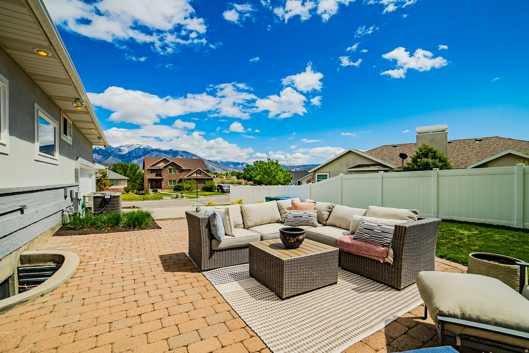 View of patio with a mountain view, outdoor lounge area, and a residential view
