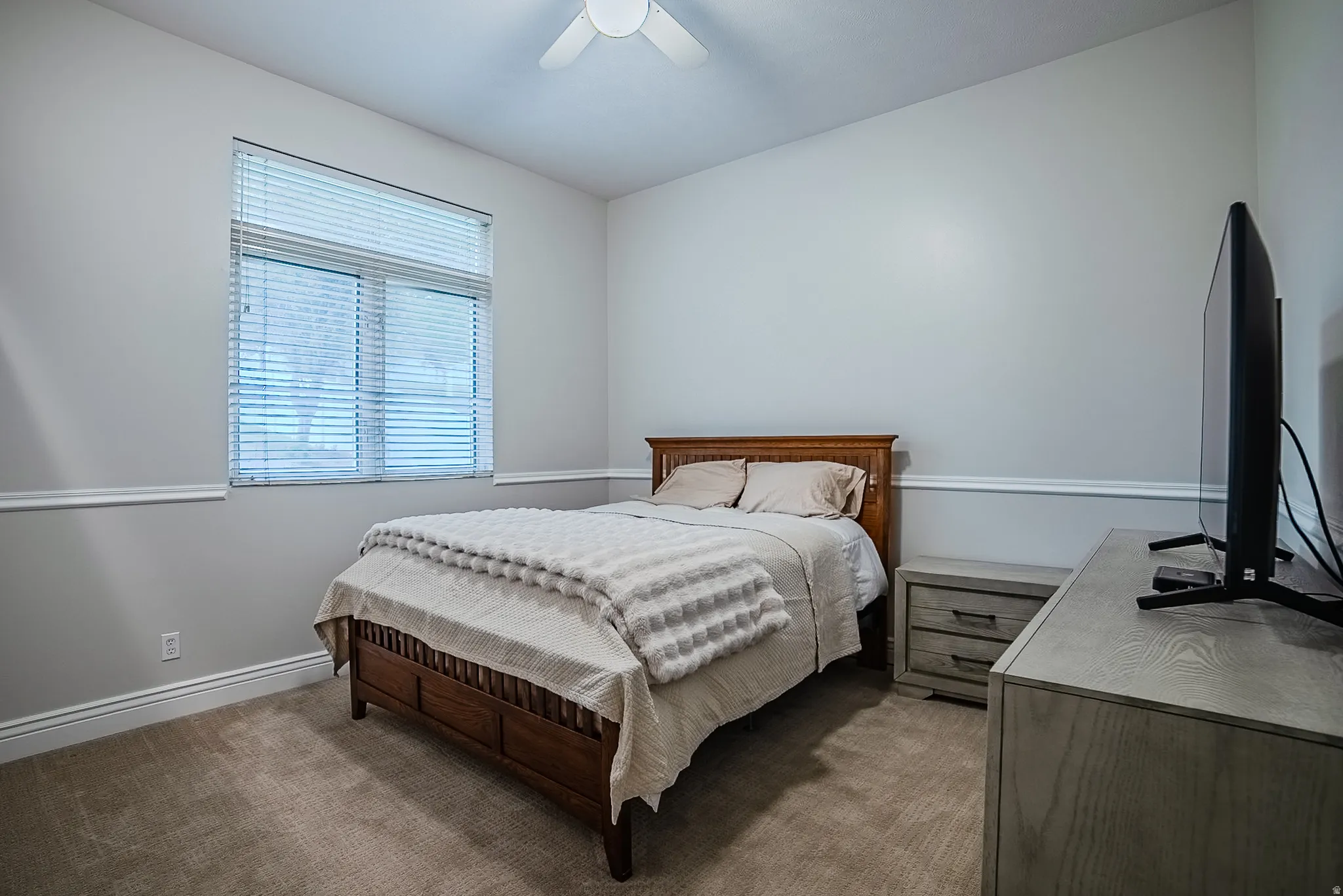 Bedroom with carpet and ceiling fan