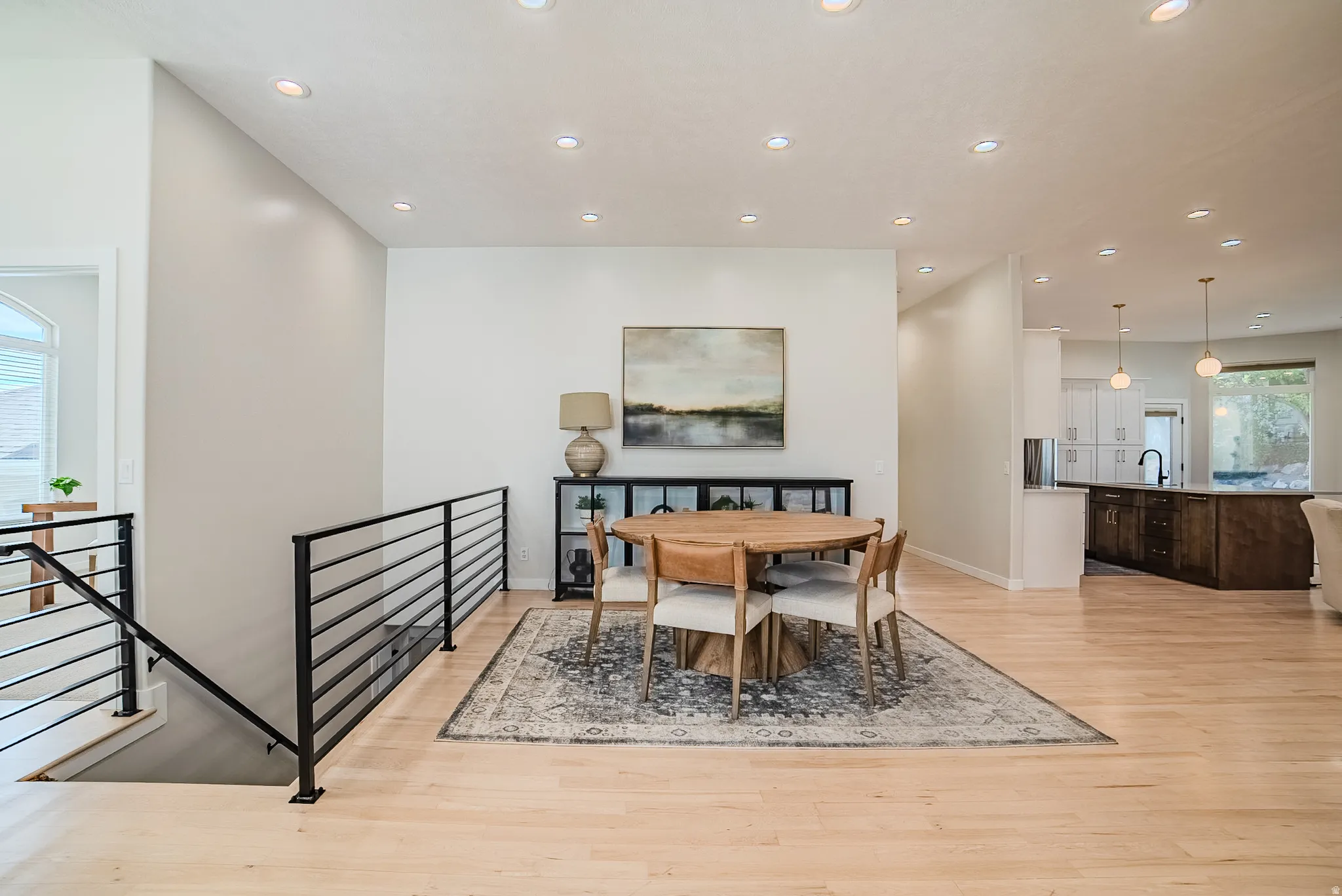 Dining room featuring light wood-style floors and recessed lighting