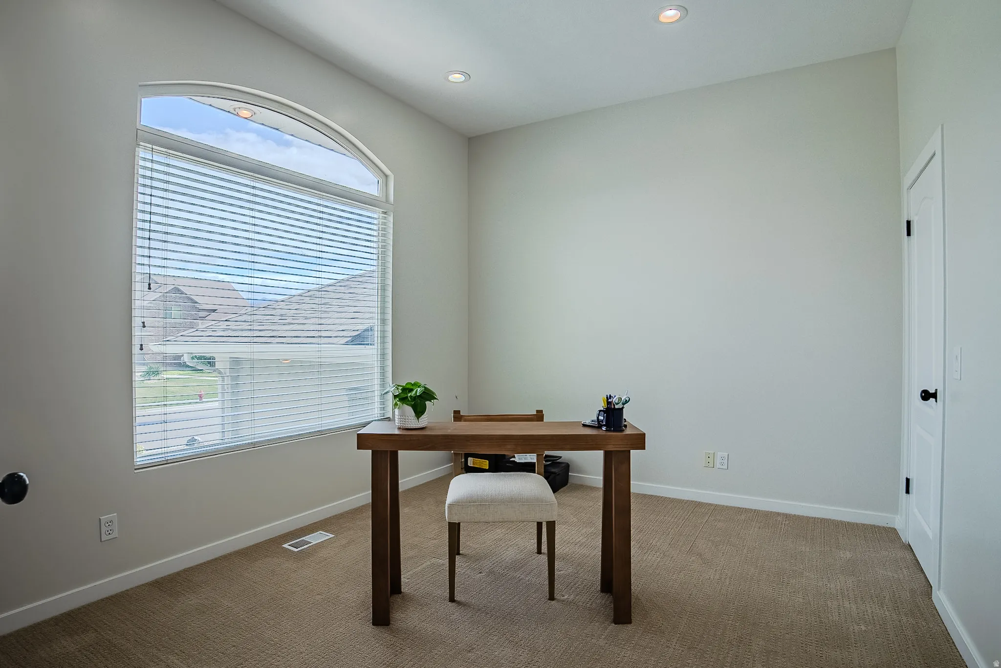 Office featuring carpet and recessed lighting