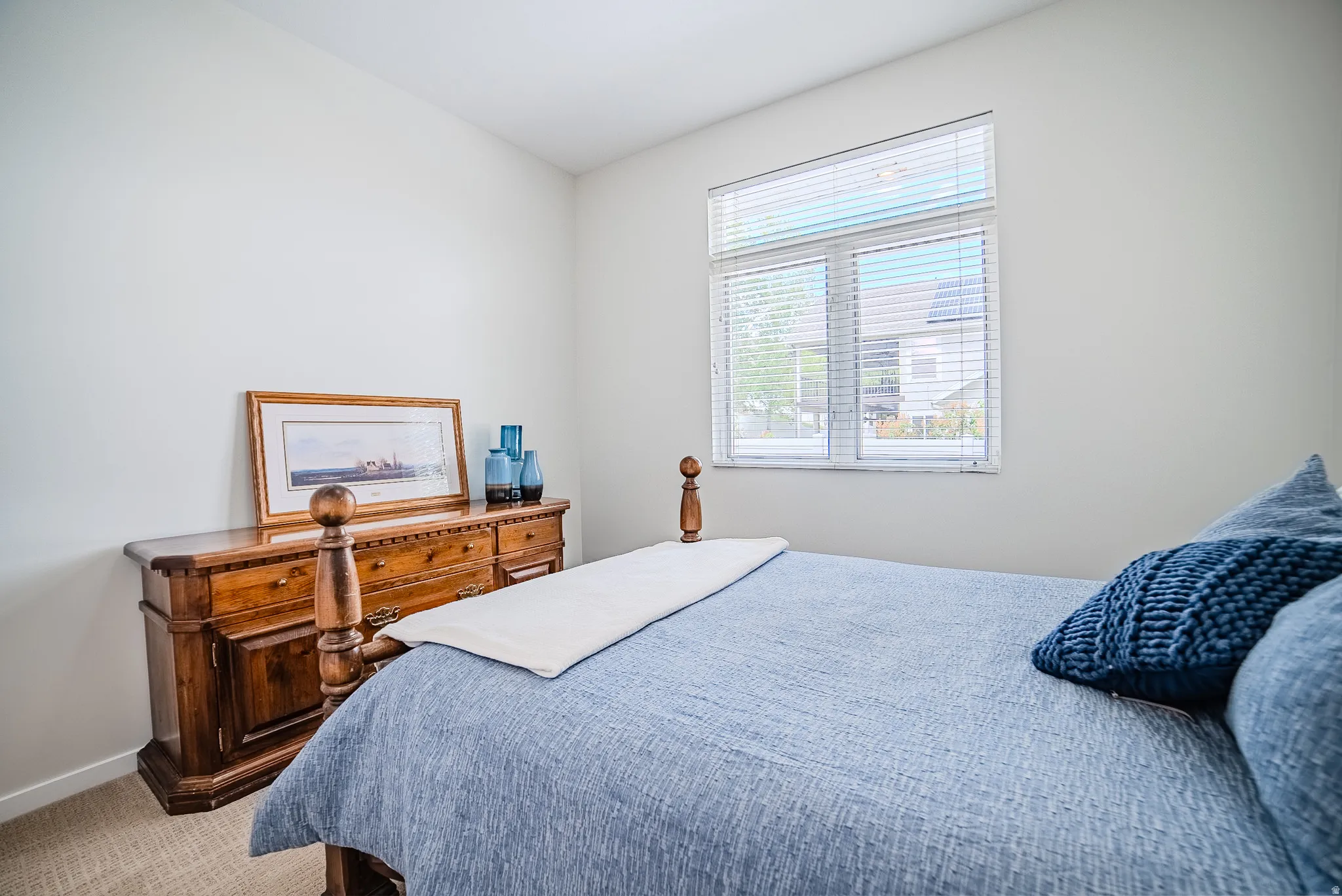 Carpeted bedroom featuring baseboards