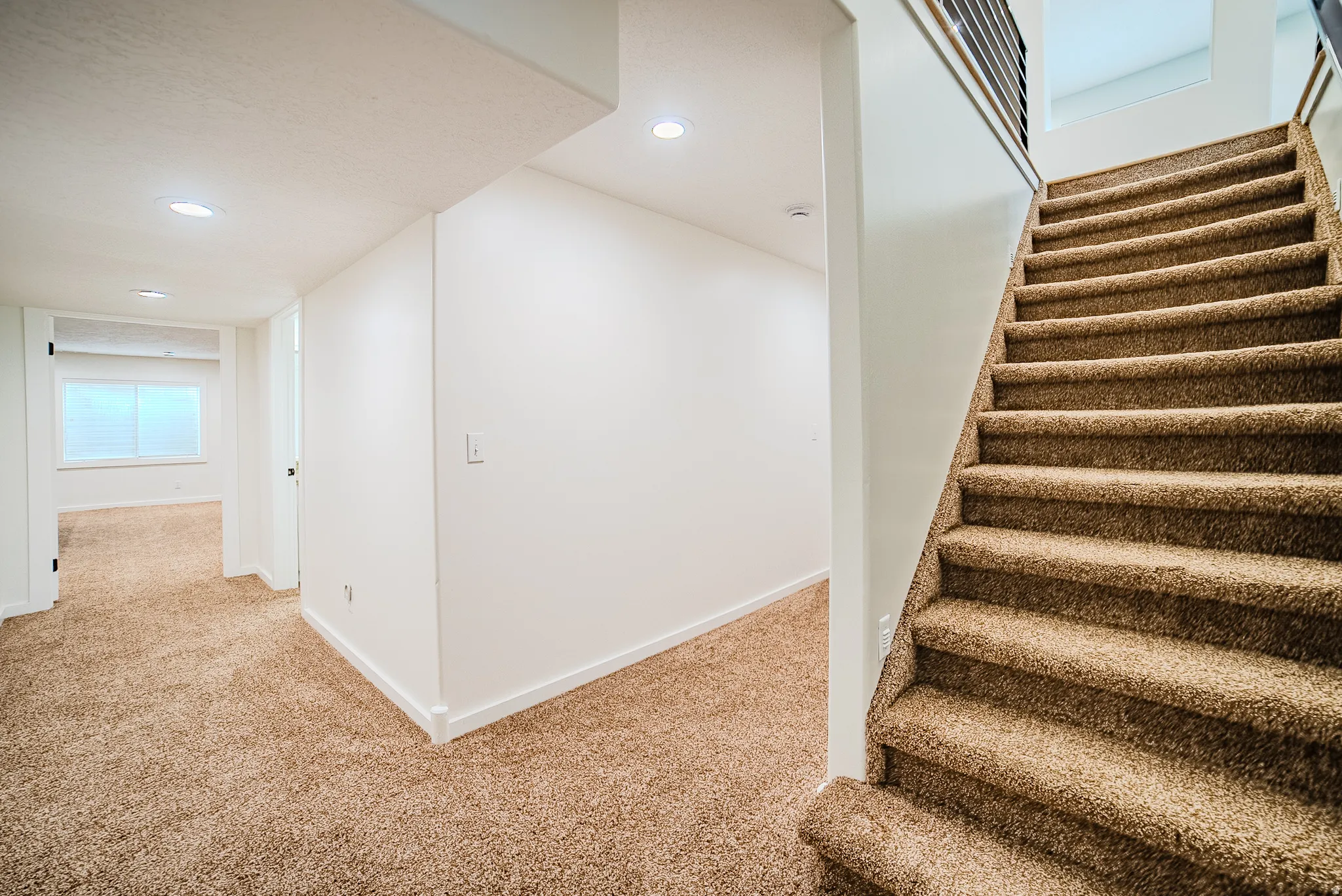 Stairway featuring carpet floors and recessed lighting