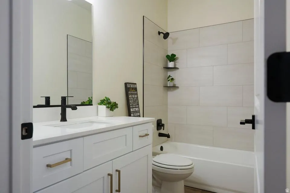 Bathroom with vanity and shower / bath combination