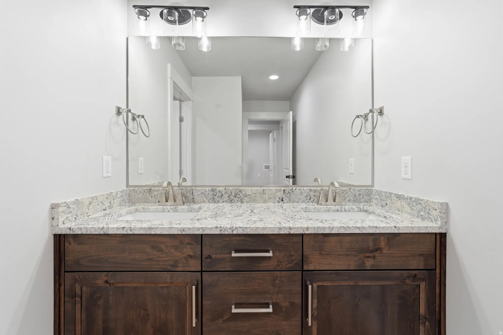 Bathroom featuring double vanity and recessed lighting