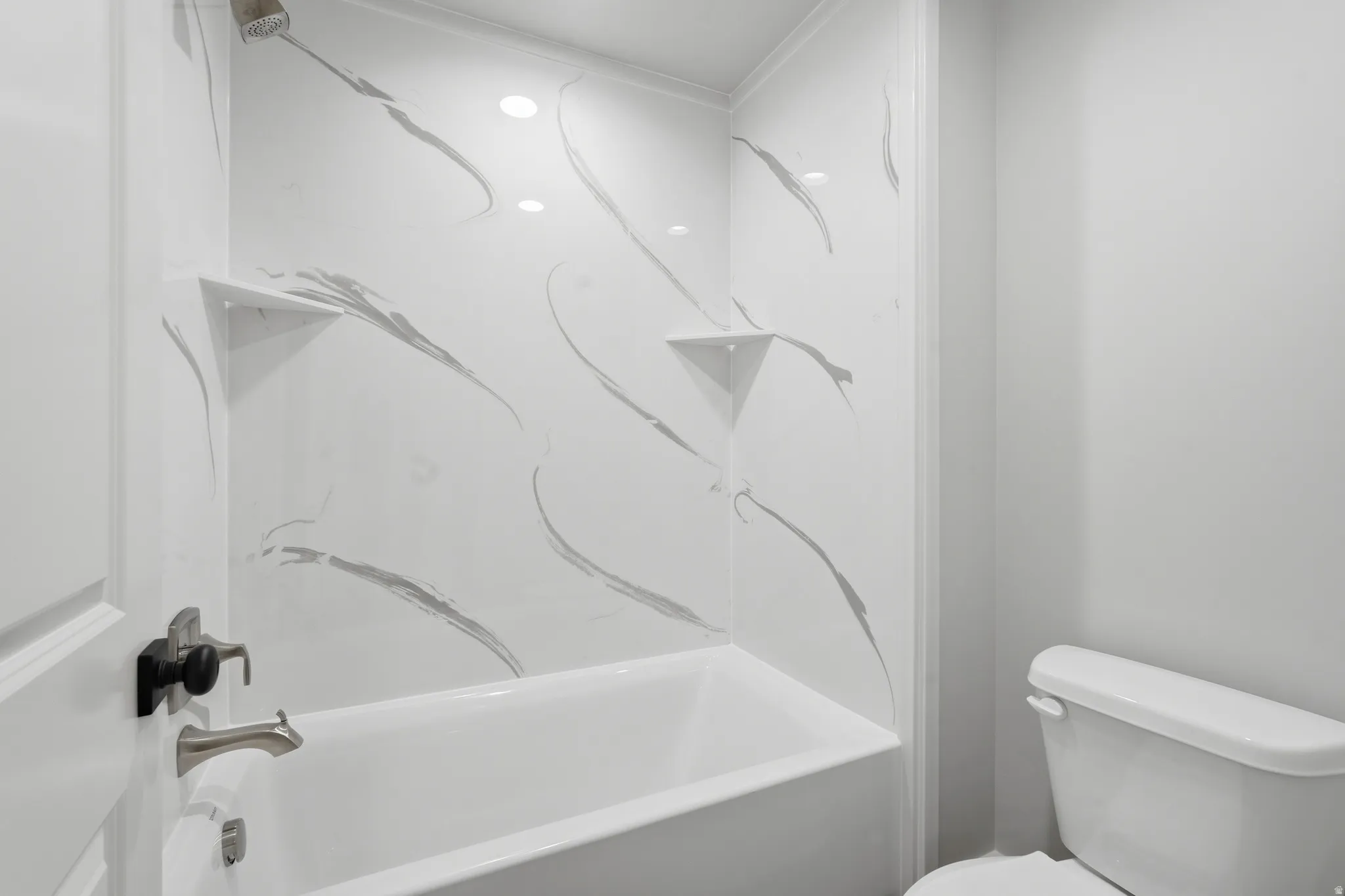 Full bath featuring toilet and bathtub / shower combination