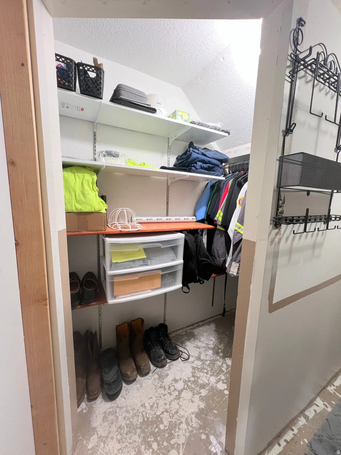 Walk in closet featuring lofted ceiling