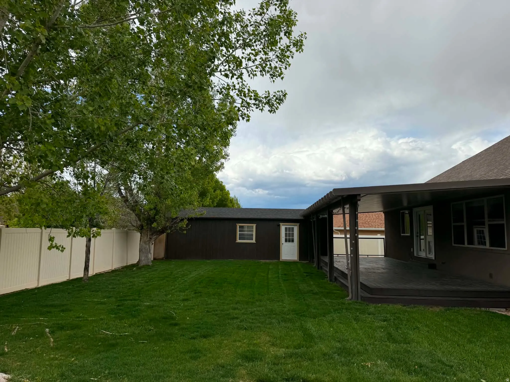 View of yard with a deck