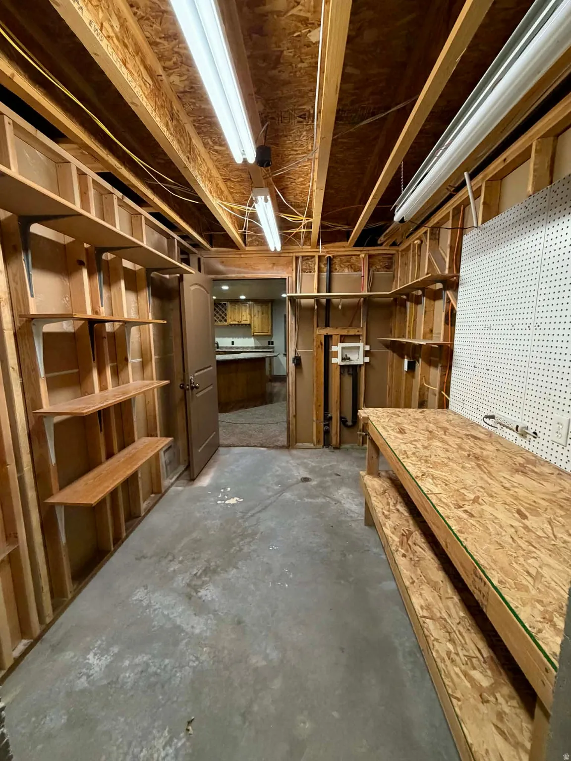 Unfinished basement featuring a workshop area