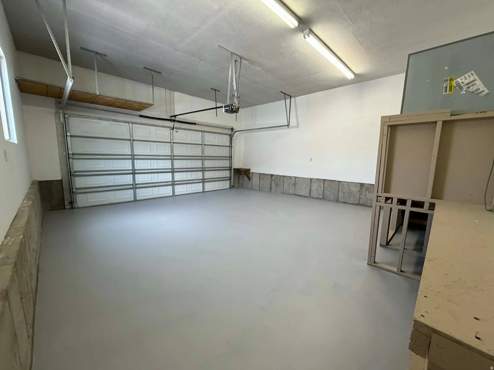 Garage featuring a garage door opener