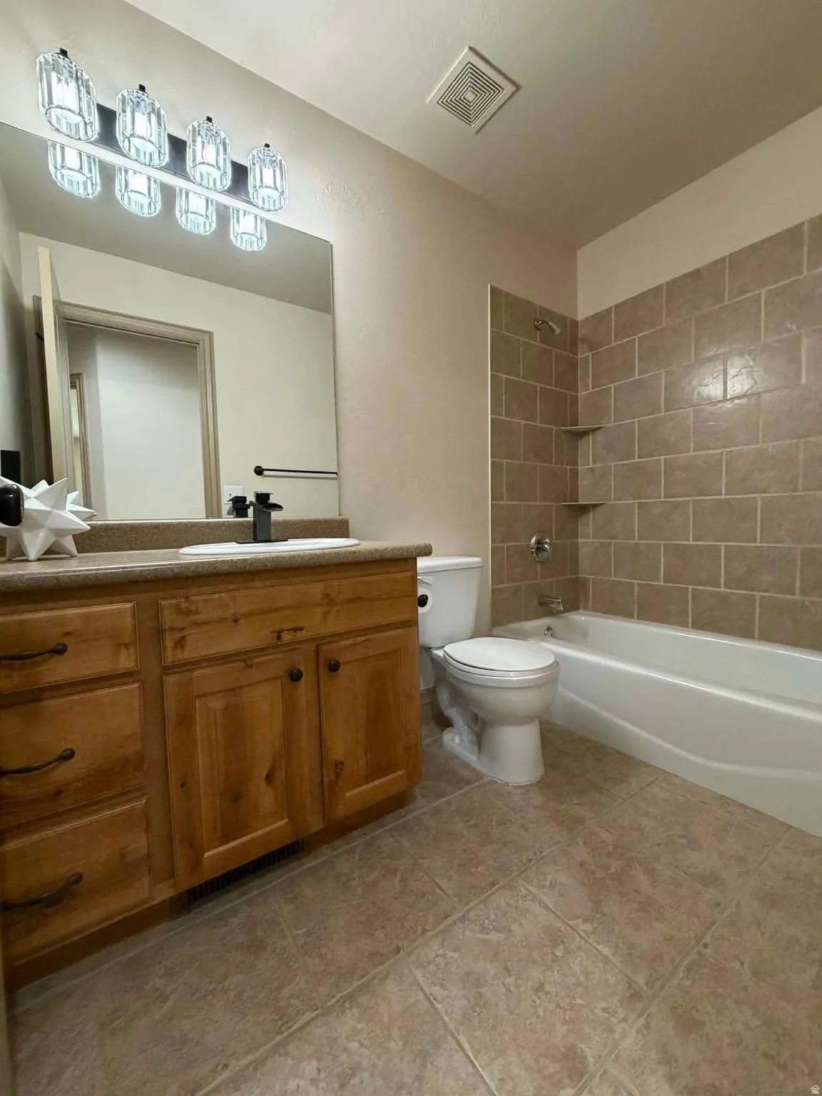 Bathroom featuring vanity and tub / shower combination