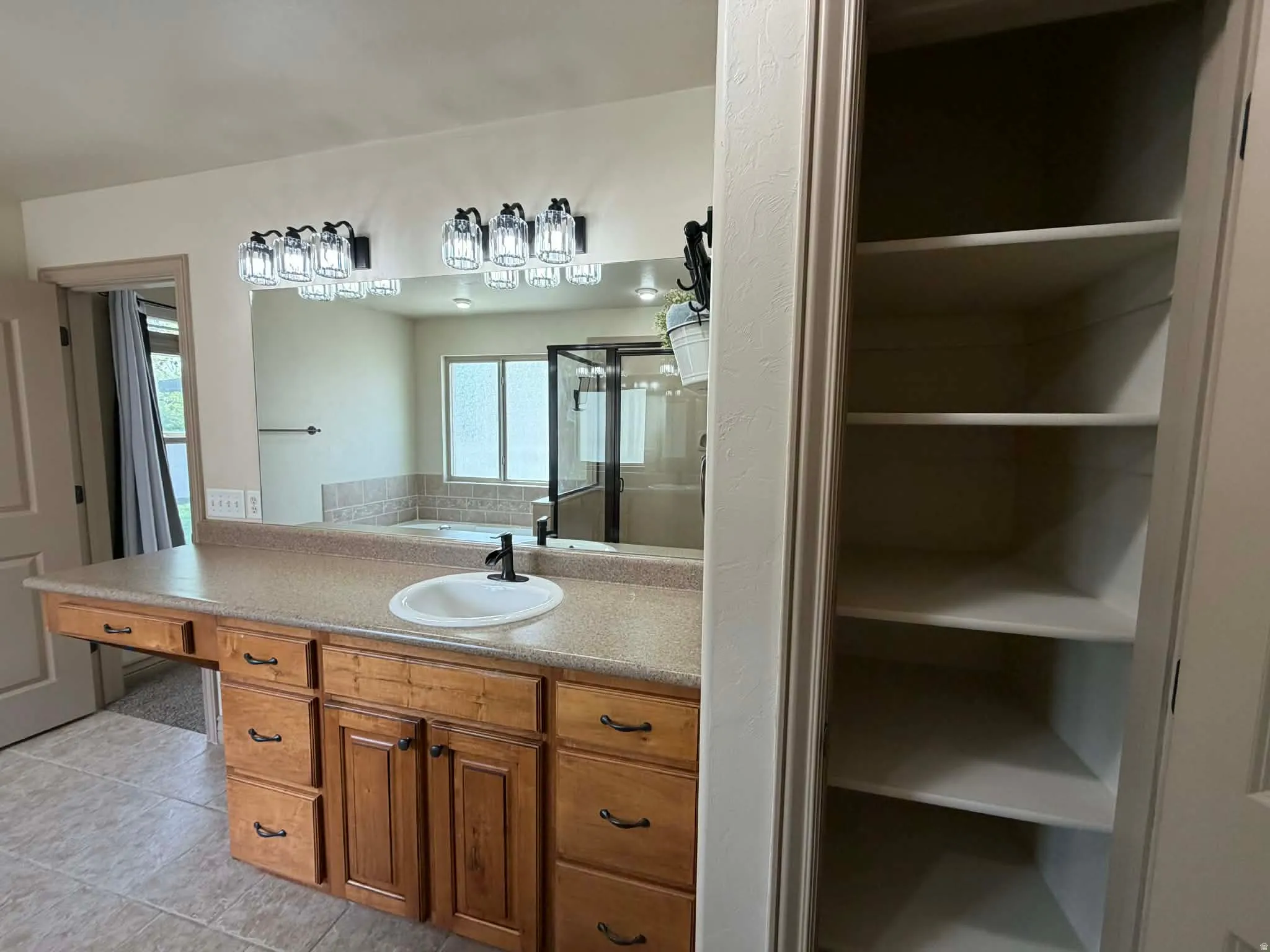 Bathroom with vanity, a shower stall, light tile patterned floors, a closet, and a bath