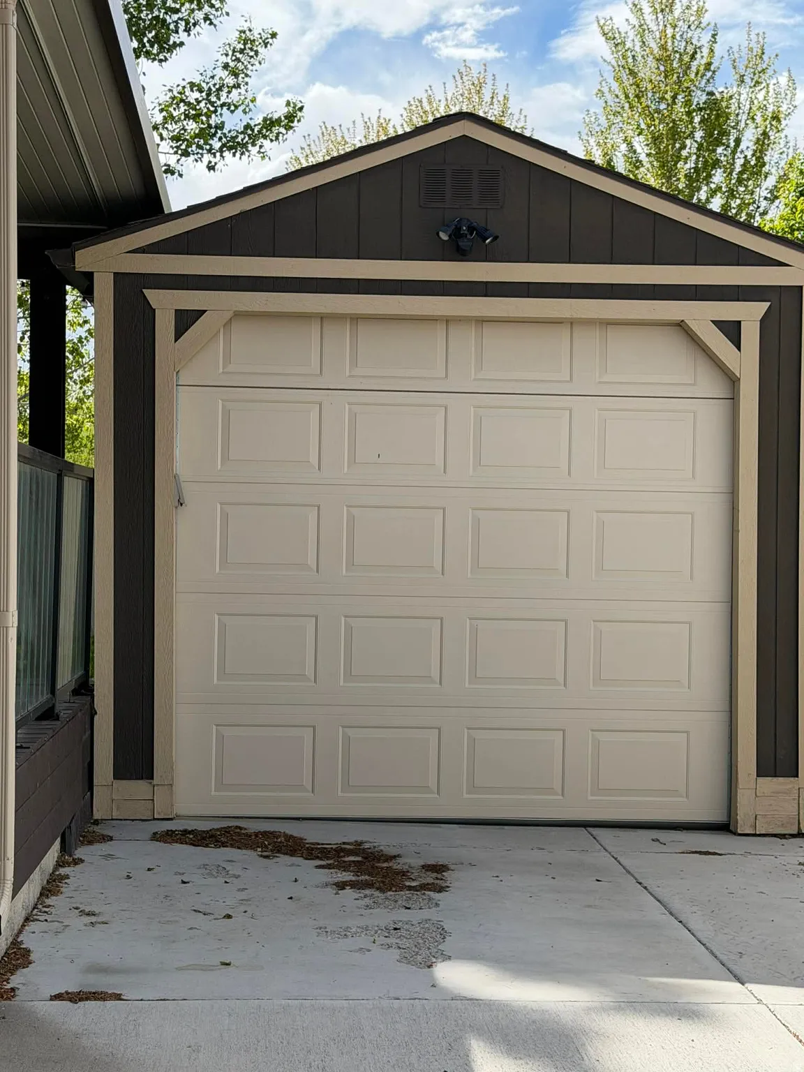 Garage featuring concrete driveway