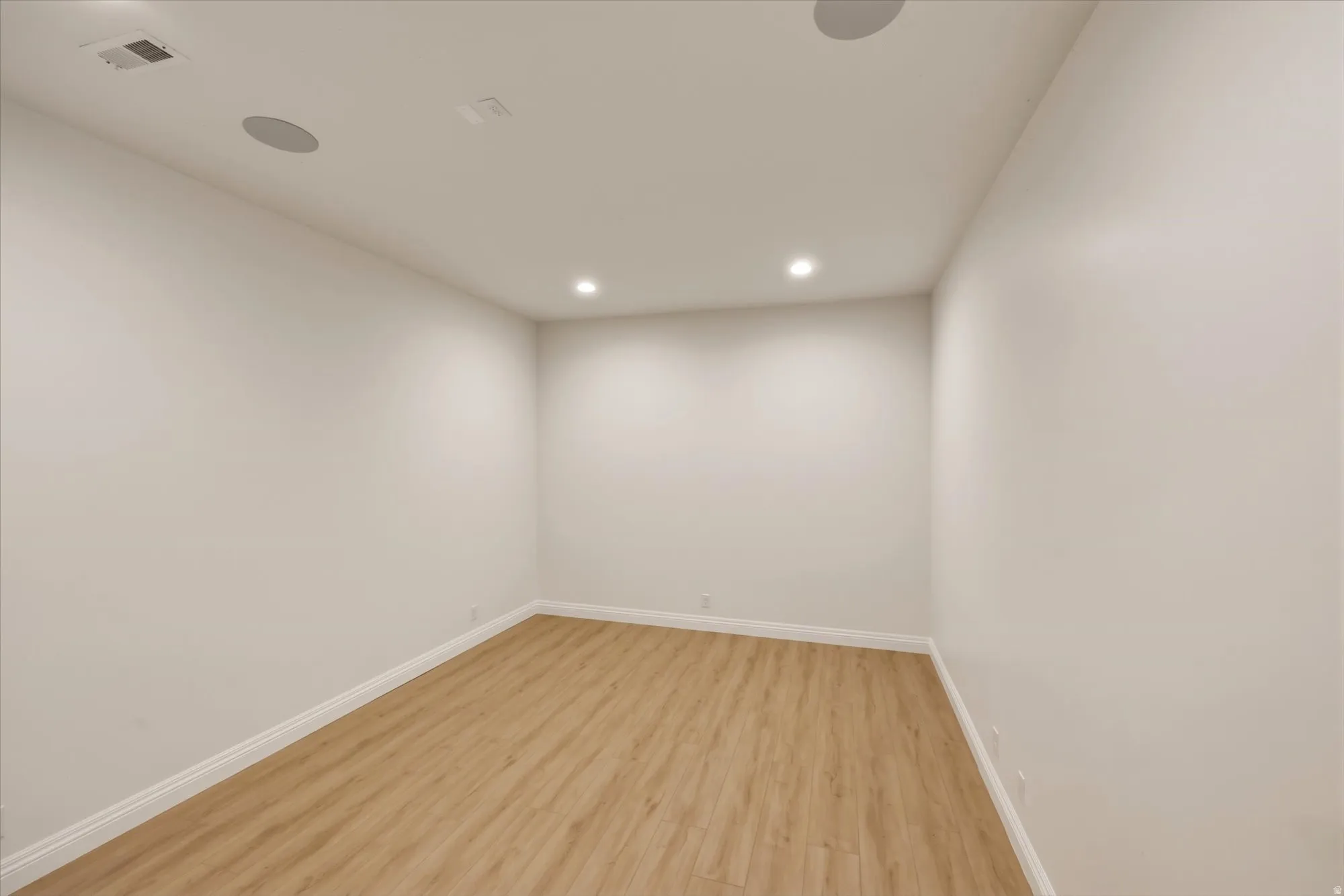 Golf simulator room off the basement recreation room