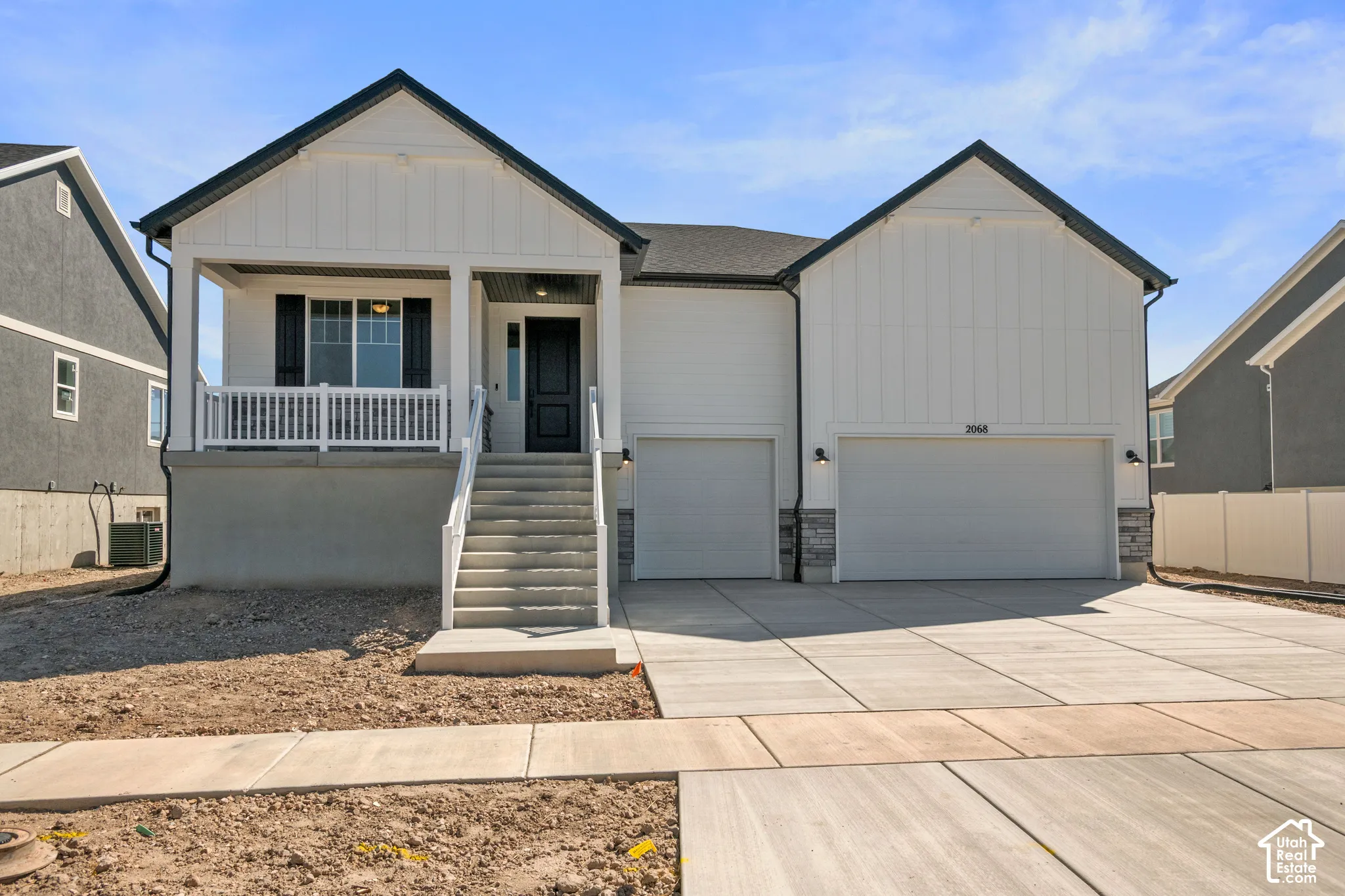 Modern farmhouse exterior with white board-and-batten siding