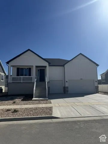White vertical siding exterior with dark trim and a covered front porch
