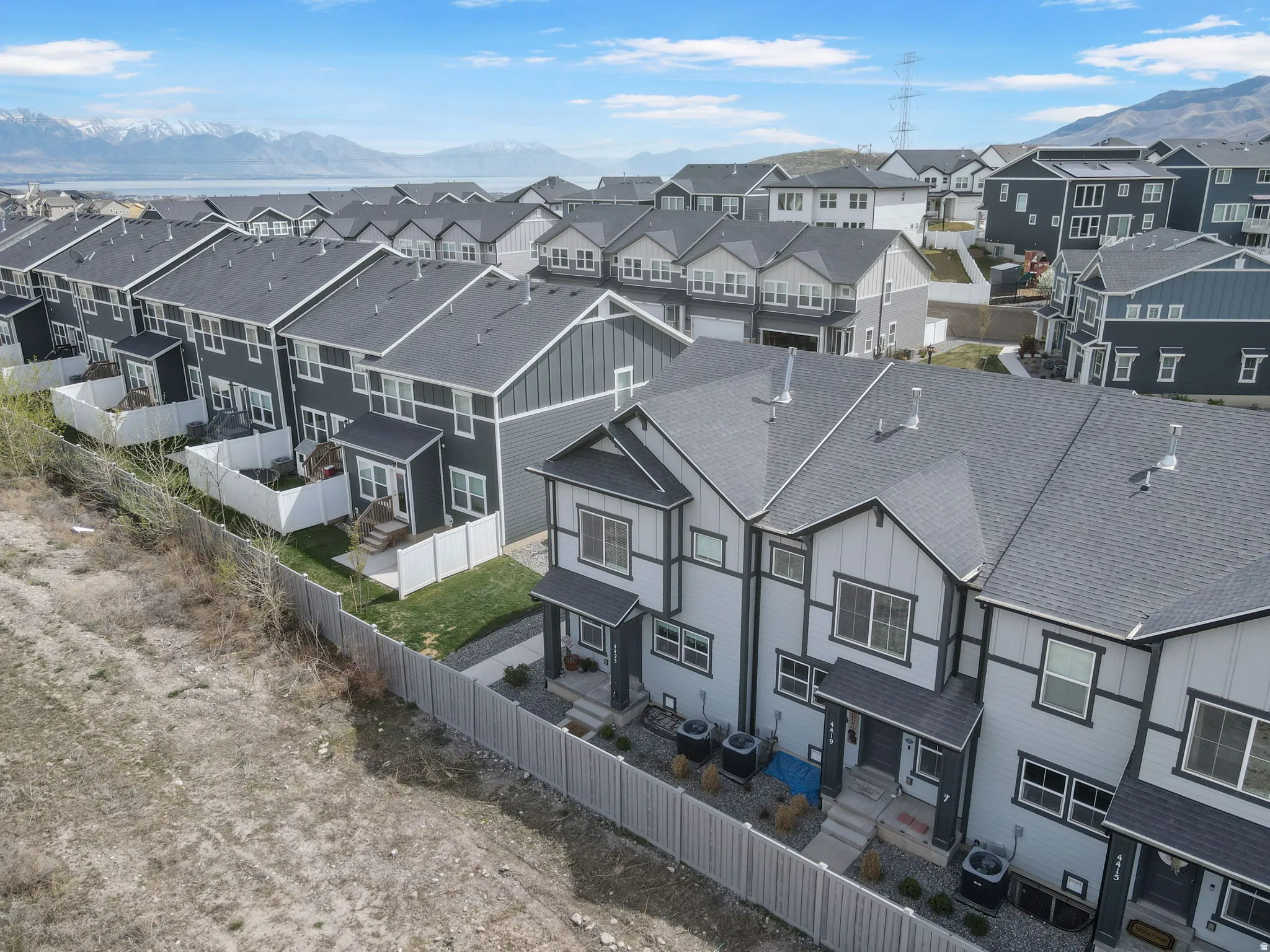 Aerial perspective of suburban area with a mountain backdrop