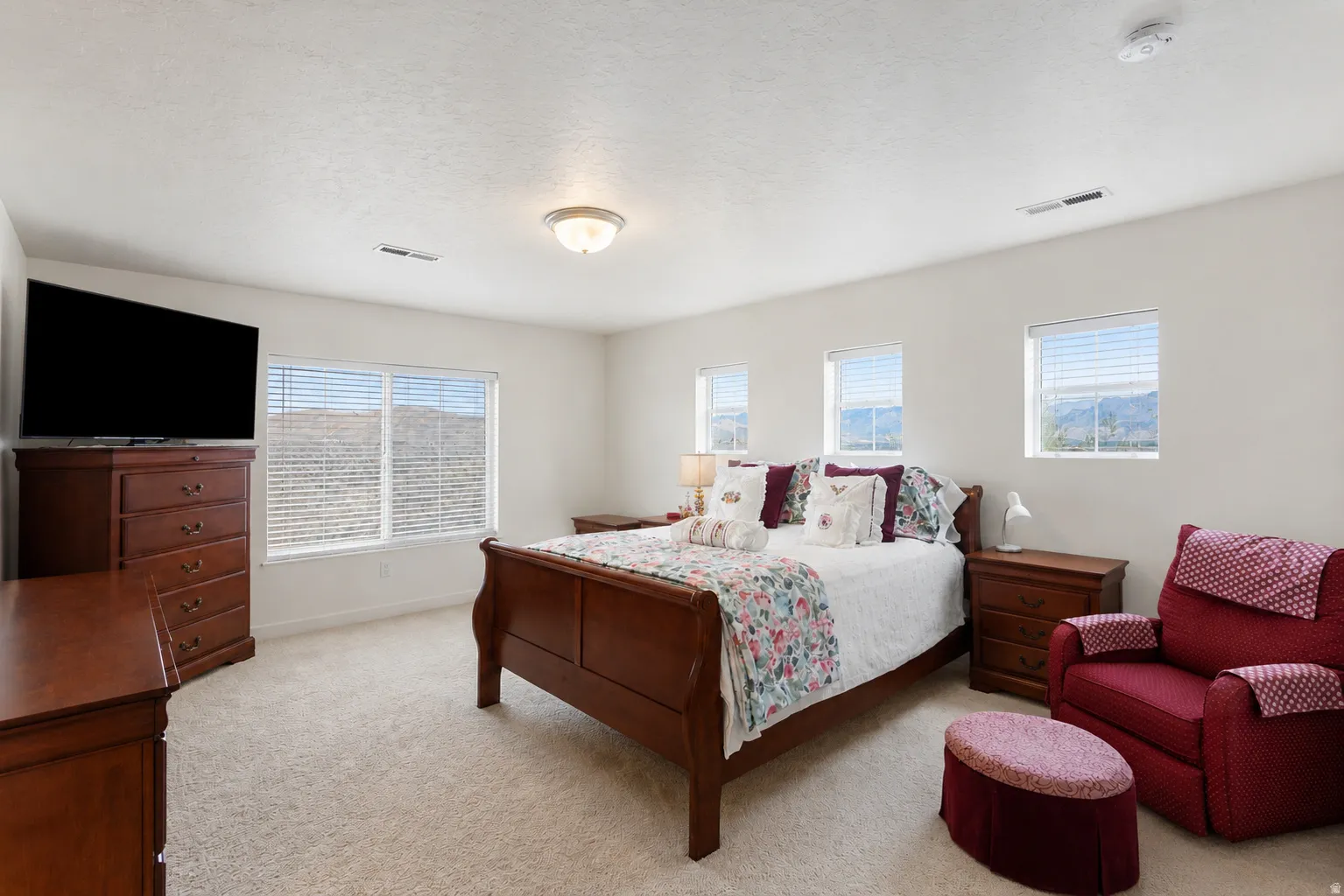 Light-toned walls with carpet flooring