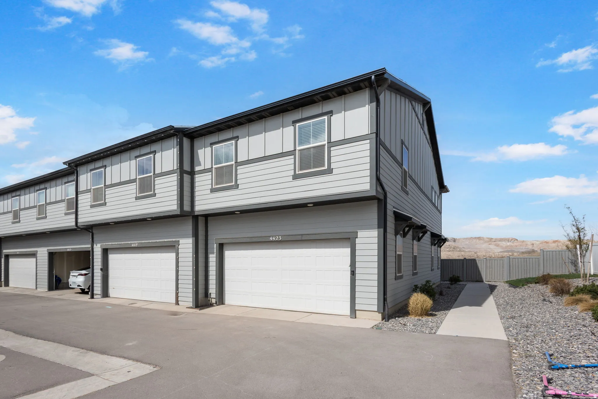 View of front of property with a garage and board and batten siding