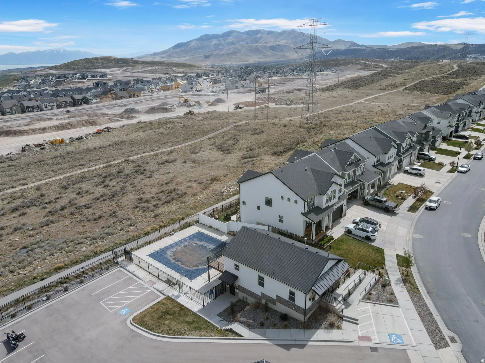 Aerial view of residential area featuring a mountainous background