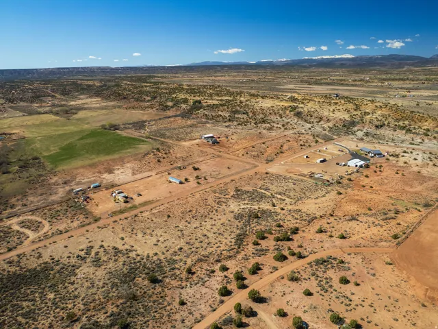 Overview of rural landscape with a desert landscape and a mountainous background