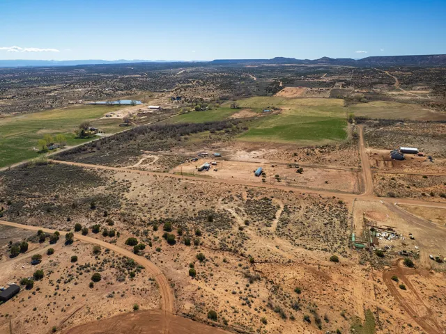 Aerial overview of property's location featuring a water and mountain view and rural landscape