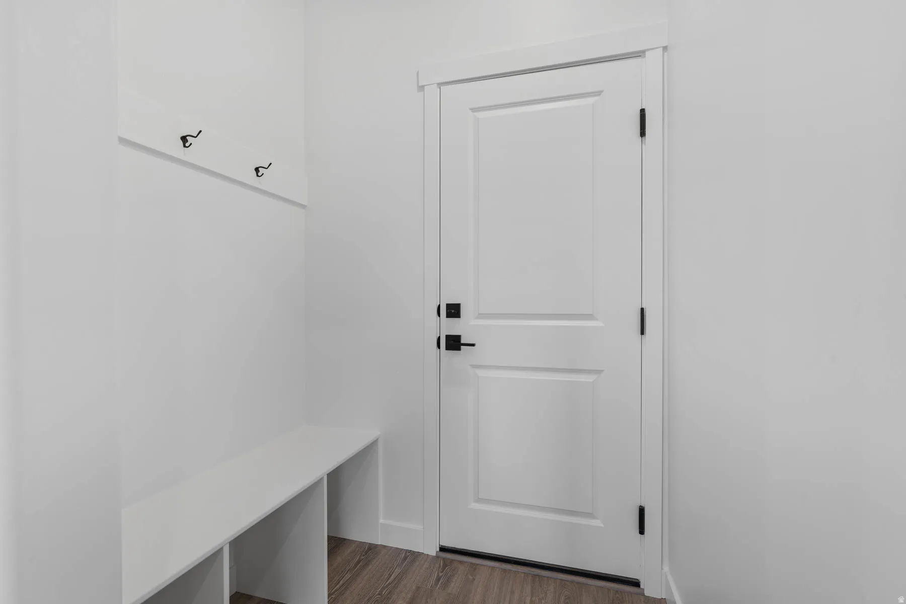 Mudroom featuring dark wood-style flooring