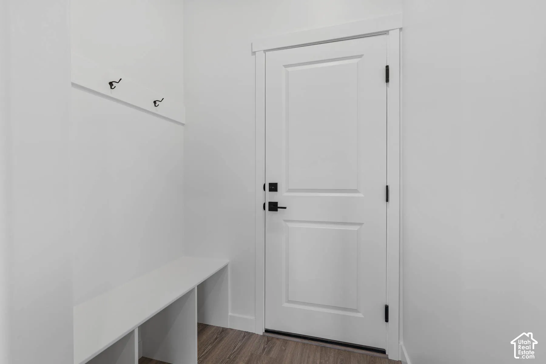Mudroom featuring dark wood-style flooring
