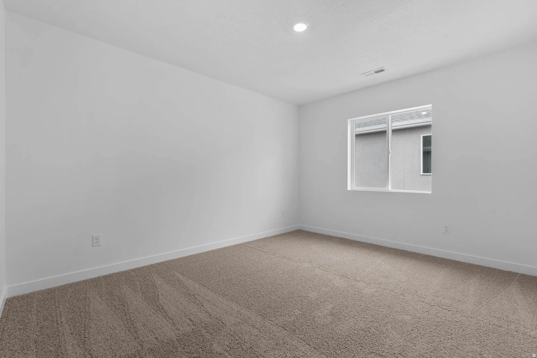 Unfurnished room with carpet flooring and baseboards