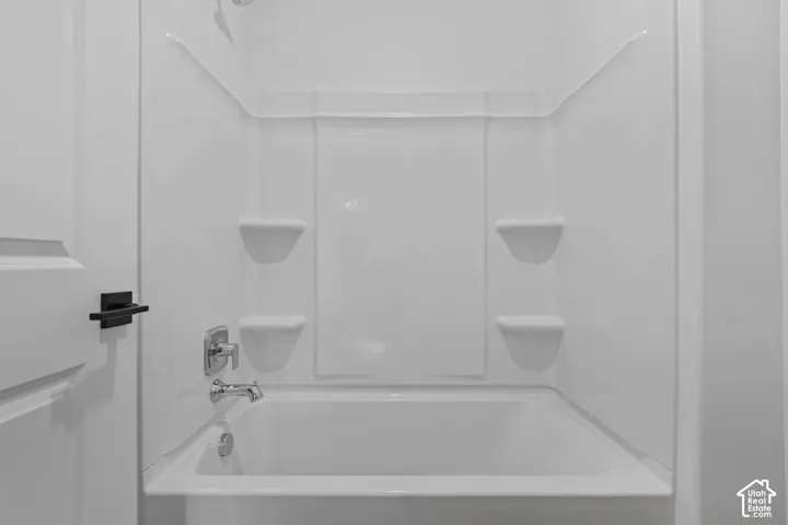 Bathroom with shower / washtub combination