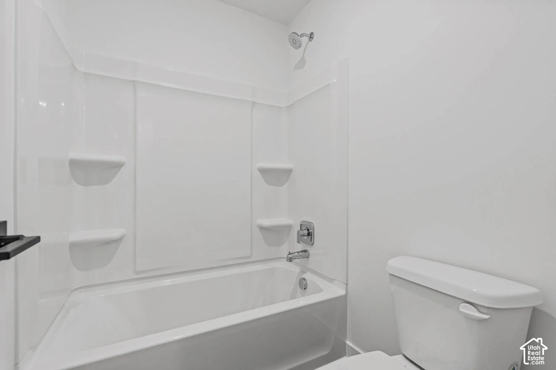 Bathroom featuring toilet and  shower combination