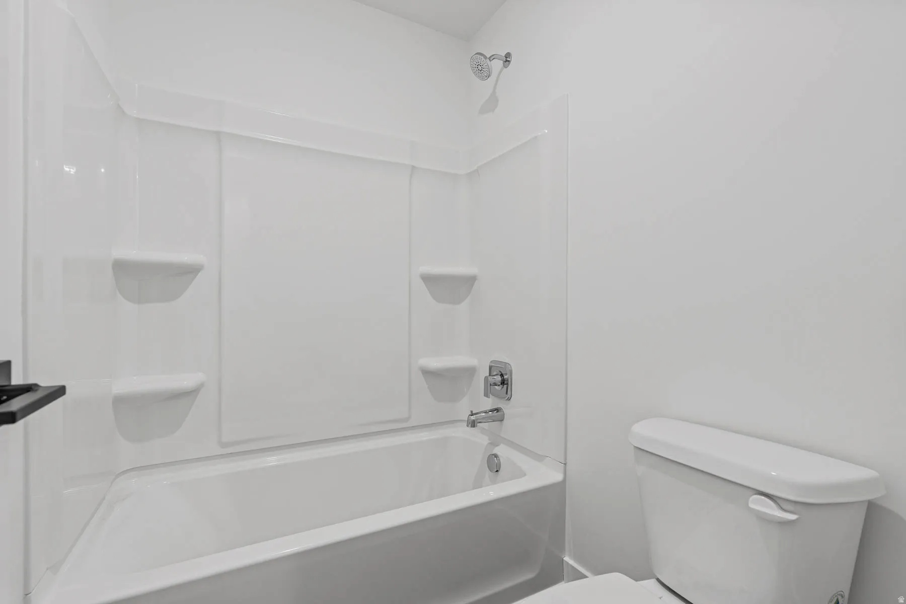 Bathroom featuring toilet and  shower combination