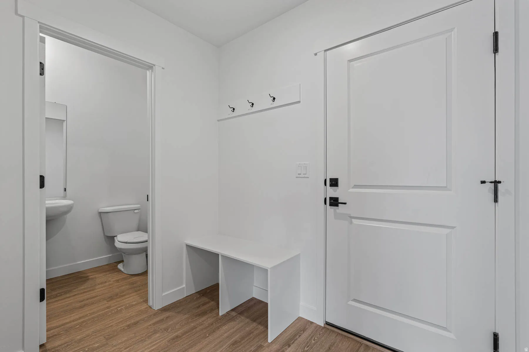 Mudroom featuring light wood finished floors