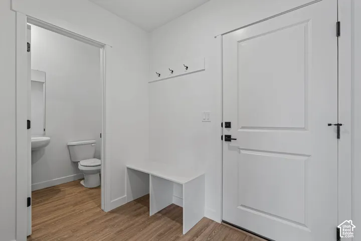 Mudroom featuring light wood finished floors