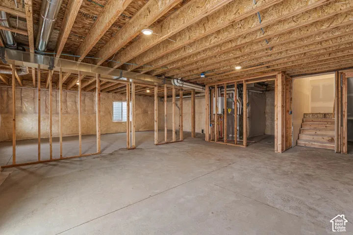 Basement with stairs and heating unit