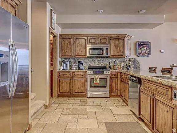 Kitchen featuring lots of cabinets