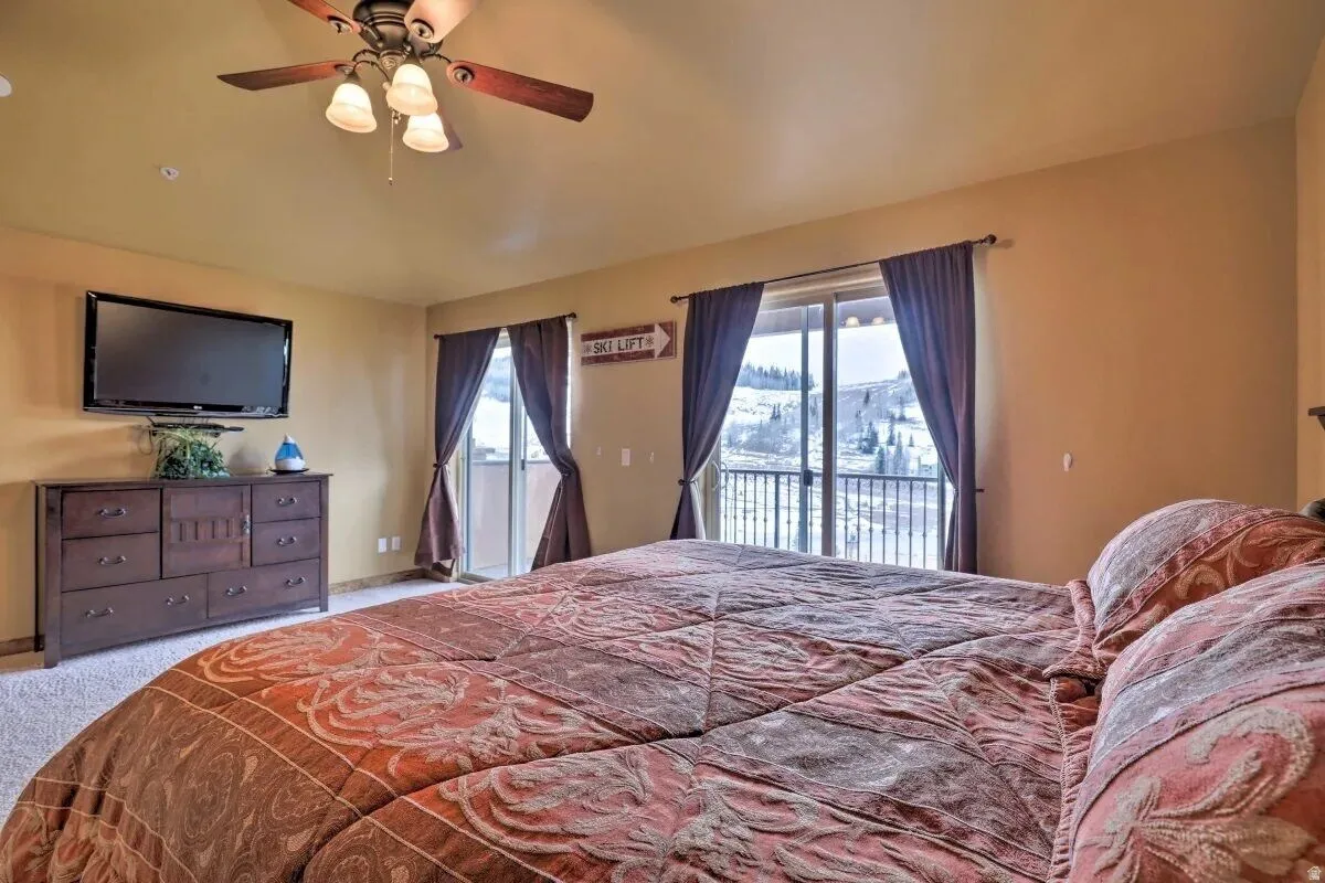 Primary bedroom with door to private deck
