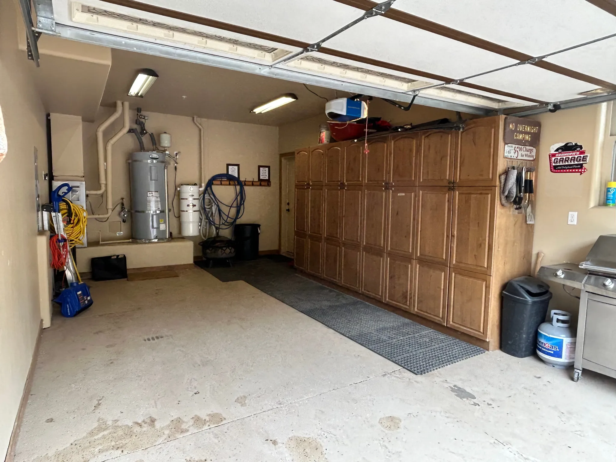 Garage featuring cabinets for storage