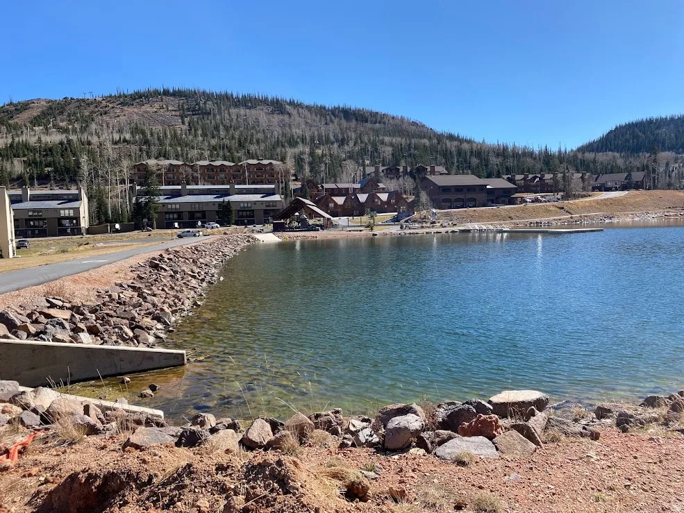 Fishing pond and a distant mountain backdrop