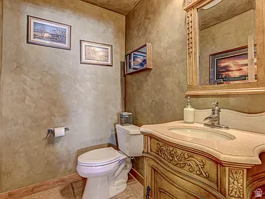 Half bathroom featuring toilet and vanity