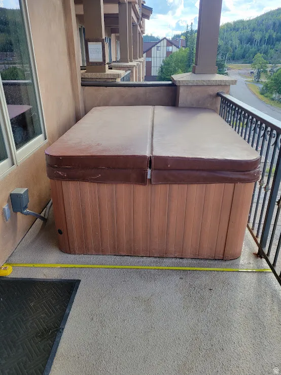 View of patio / terrace featuring a hot tub