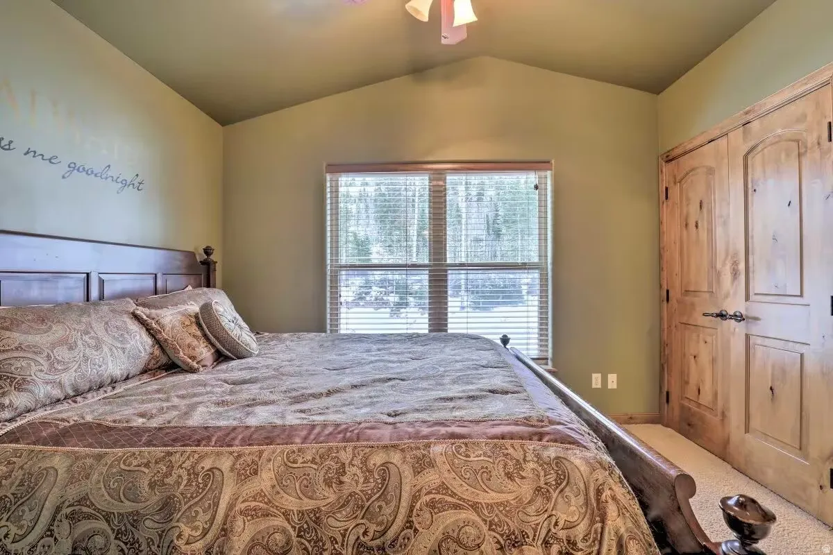 Bedroom suite with vaulted ceiling