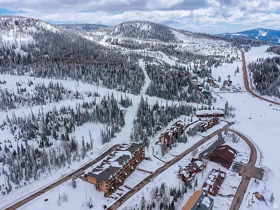 Snowy aerial view featuring a mountain view