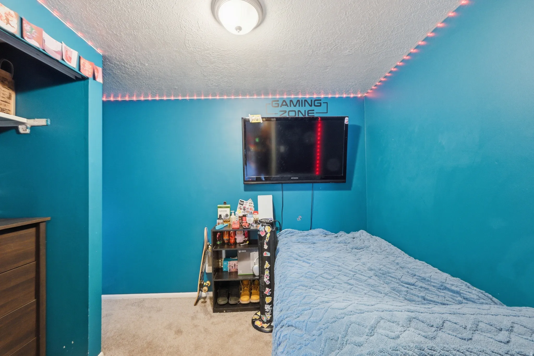 Bedroom #3 - carpeted and featuring baseboards and a textured ceiling